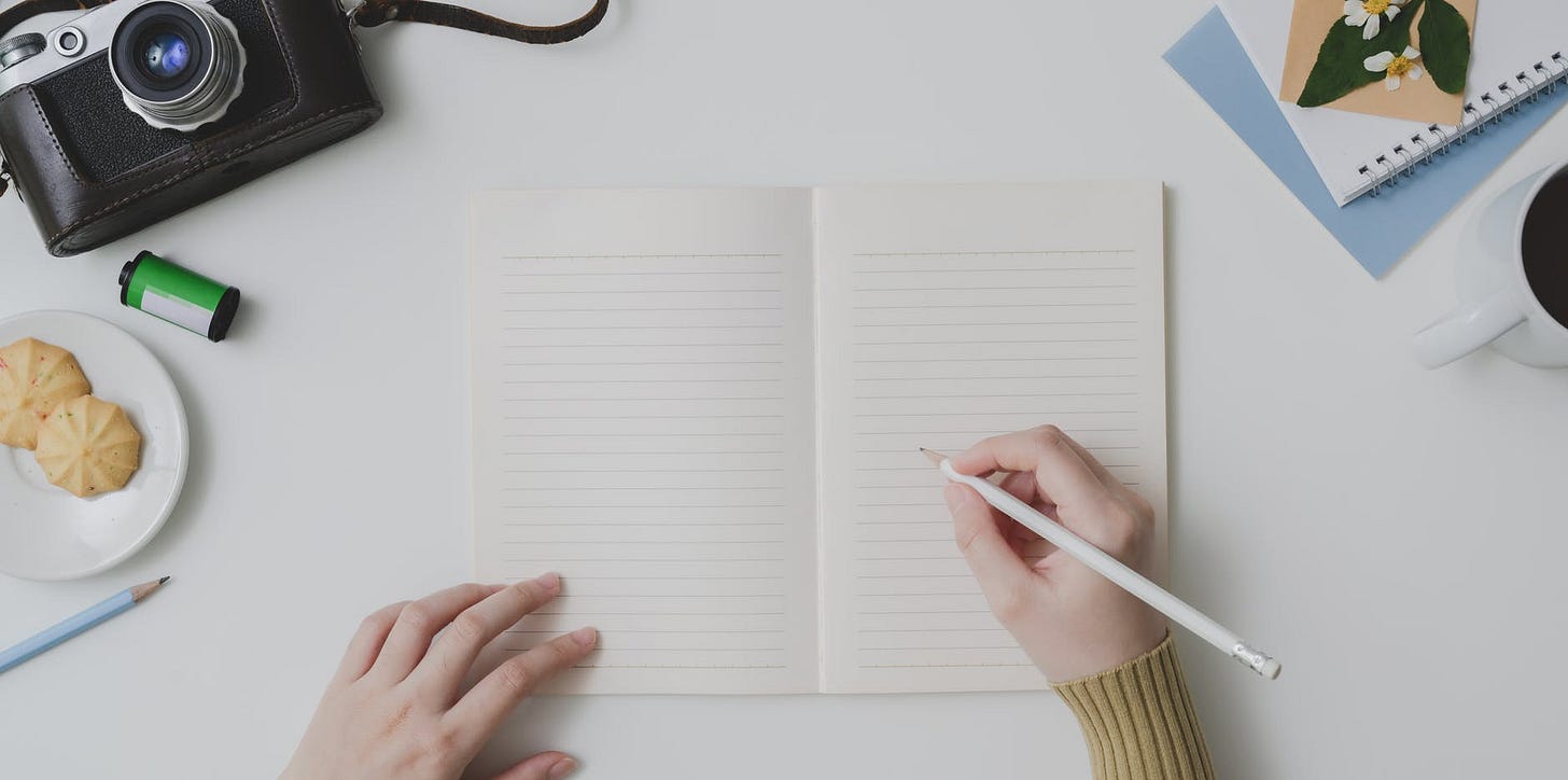 crop person writing notes in notebook crop person writing notes in notebook