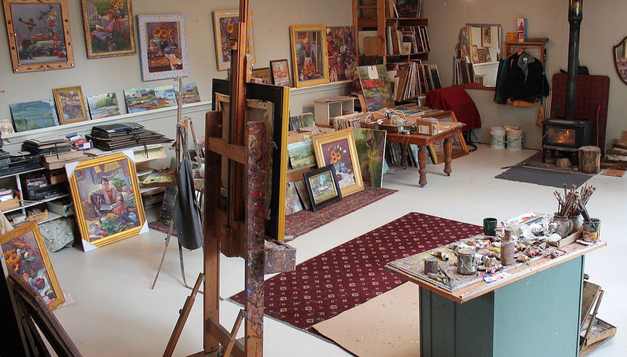 A room with art and paintings

Description automatically generated