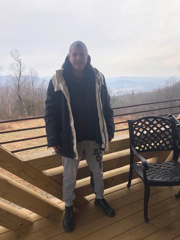 May be an image of 1 person, standing, tree, sky and mountain