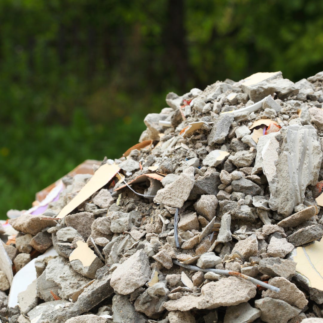 A pile of broken concrete, wire and trash. A pile of broken concrete, wire and trash.
