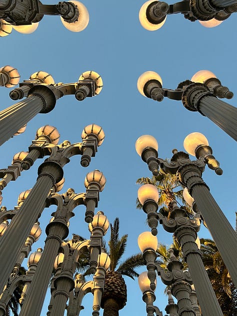 Urban Lights outside of LACMA, including photos with Hannah in front of them.