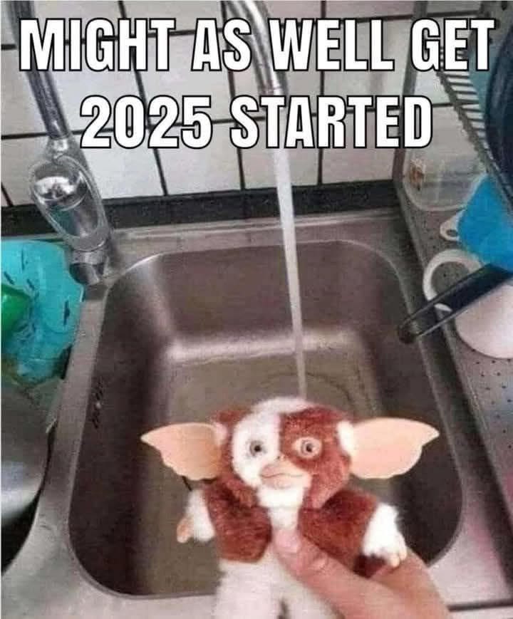A hand holding a stuffed animal in a sink

Description automatically generated
