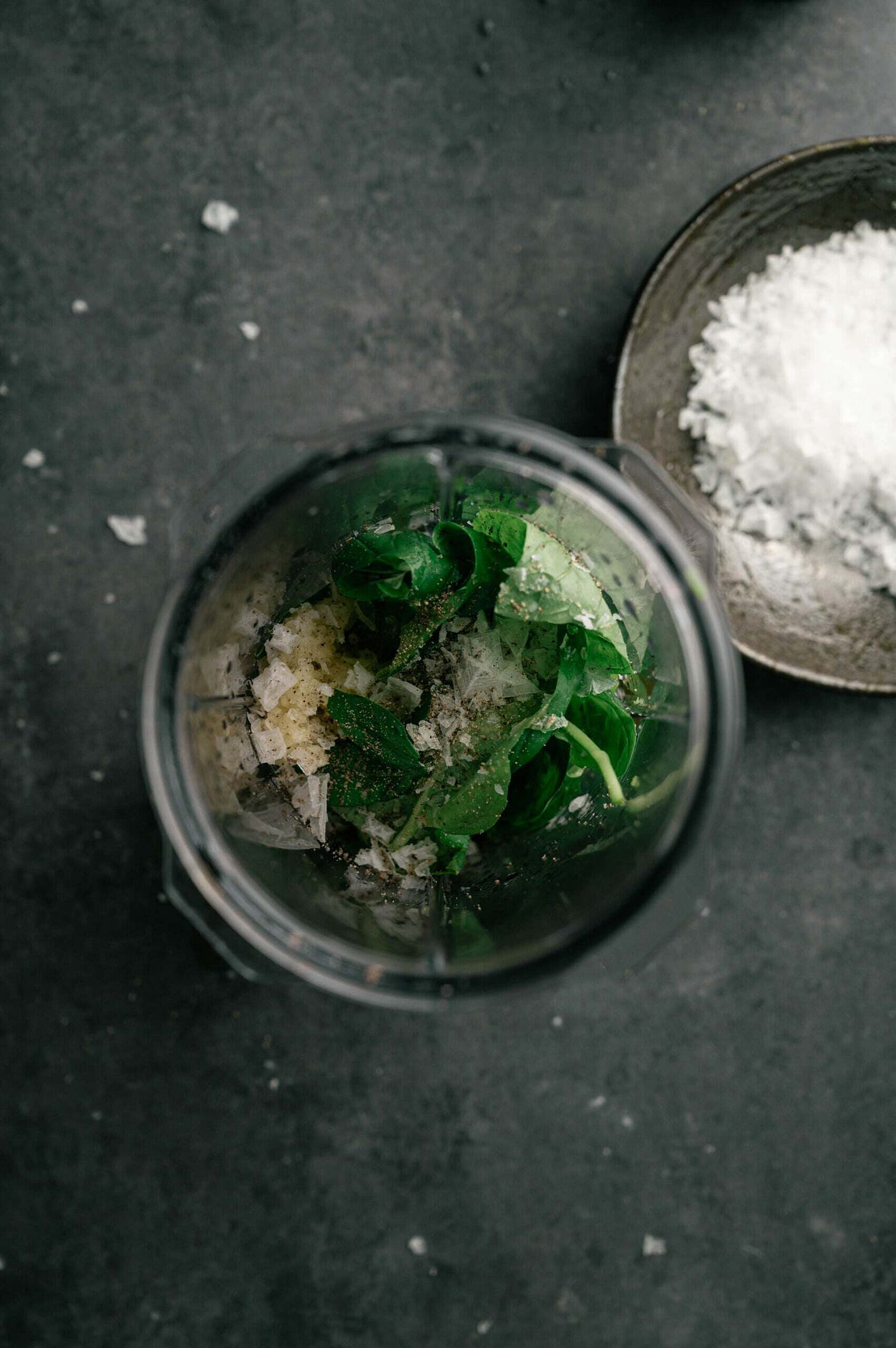 olive oil, lime juice, honey, garlic, basil, salt, and pepper in a blender for a basil-lime dressing for an arugula pear salad.