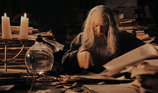 hivehearted — [ID: 3 GIFs of Gandalf reading in the library of...