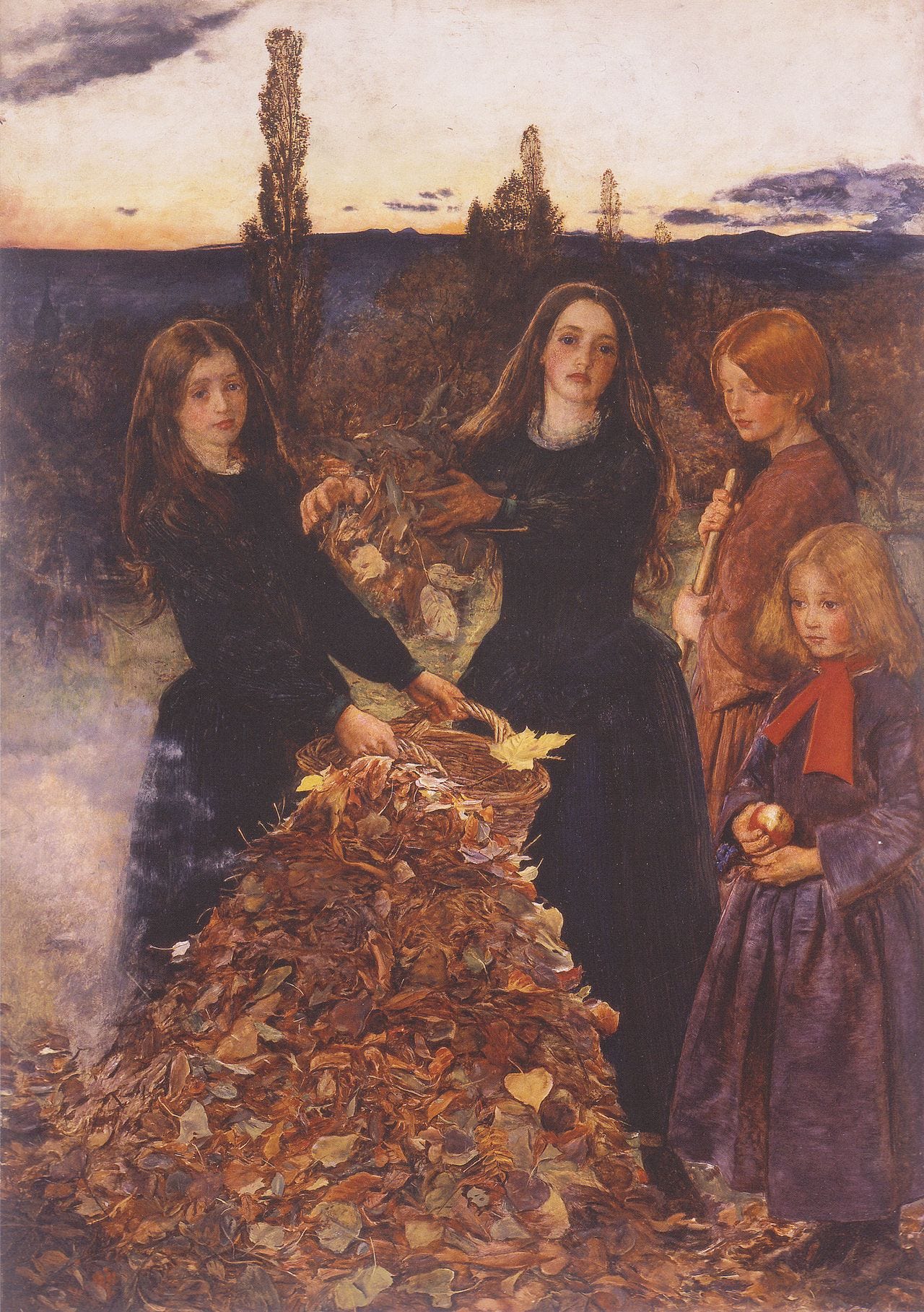 Four girls at dusk raking a heap of leaves to burn Four girls at dusk raking a heap of leaves to burn