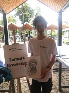 A person holding a drawing

AI-generated content may be incorrect.