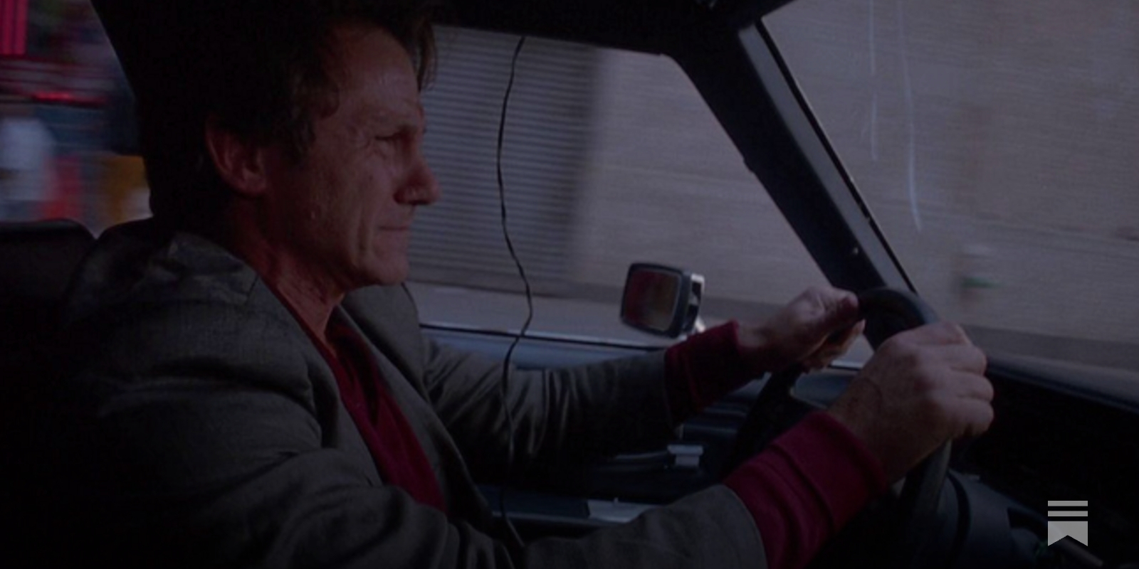 A screenshot from an old film noir movie with a dramatic scene and a mysterious atmosphere