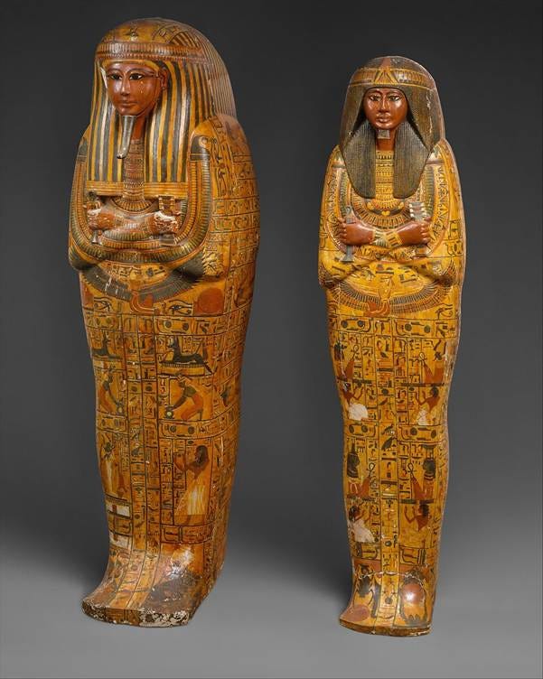 The anthropoid coffins of Khonsu from the New Kingdom Ramesside period, Metropolitan Museum of Art. Two richly painted wooden coffins showing the characteristic human-form shape, gilded face, and hieroglyphic decoration typical of elite New Kingdom burials.