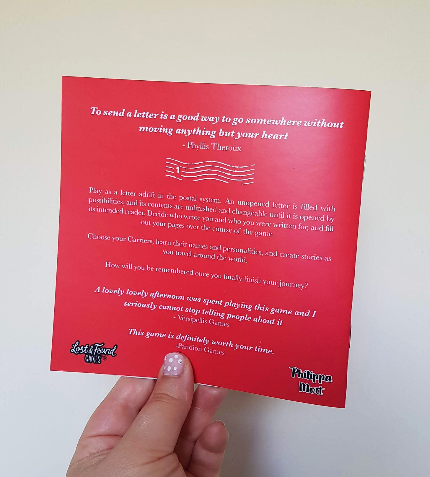 Back of Lost Post. It has a blurb and some pull quotes from reviews, including 'a lovely lovely afternoon was spent playing this game and I seriously cannot stop telling people about it'