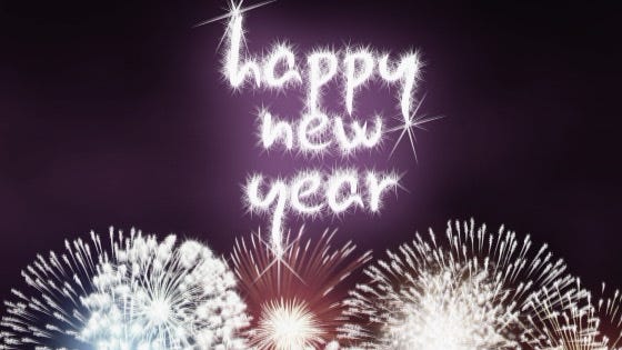 fireworks explode "happy new year" into the night