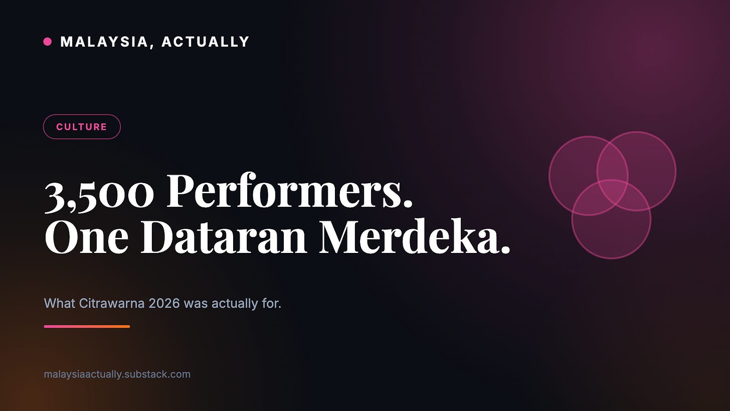 Pink title card reading 3500 Performers One Dataran Merdeka, with overlapping colour circles and the Malaysia, Actually masthead Pink title card reading 3500 Performers One Dataran Merdeka, with overlapping colour circles and the Malaysia, Actually masthead