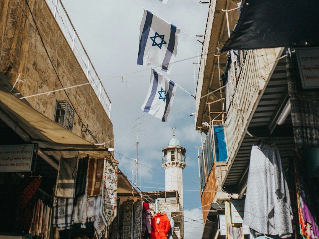 flags hanging on roof during daytime