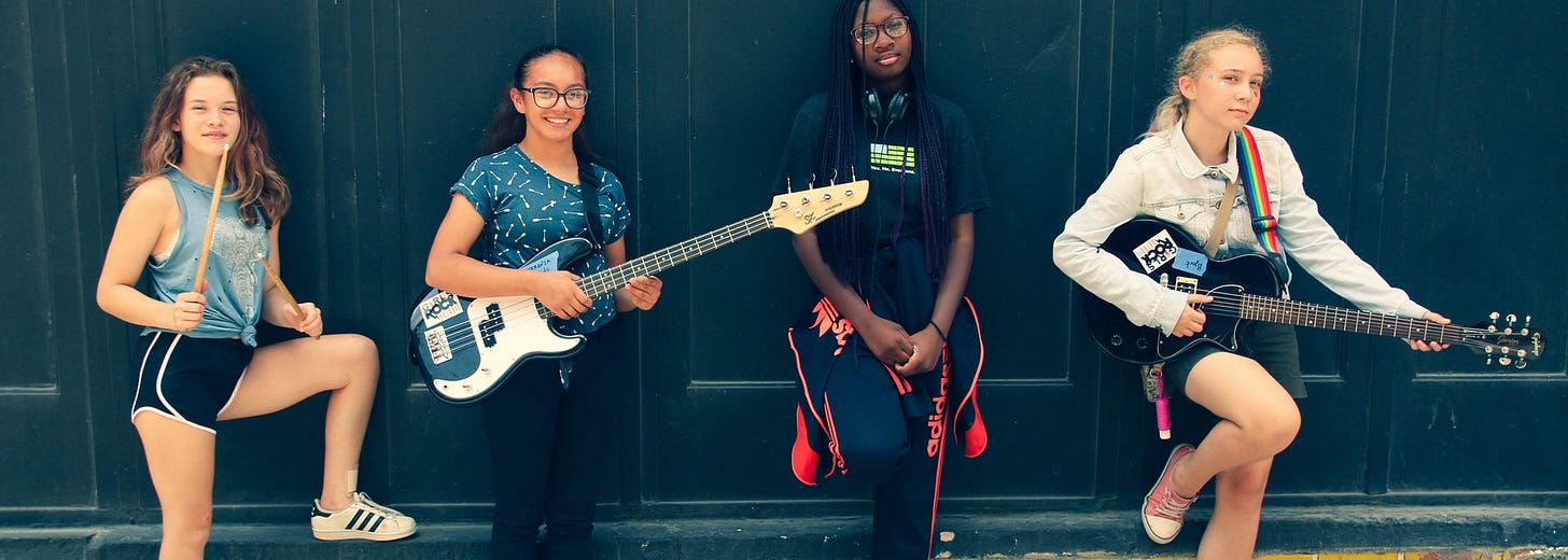 Campers posing with instruments Campers posing with instruments
