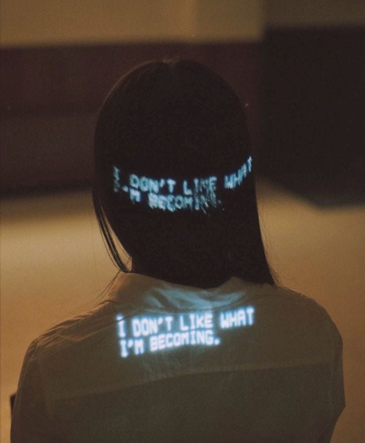 This may contain: a woman with her back turned to the camera, wearing a white shirt that says i don't like what she is doing