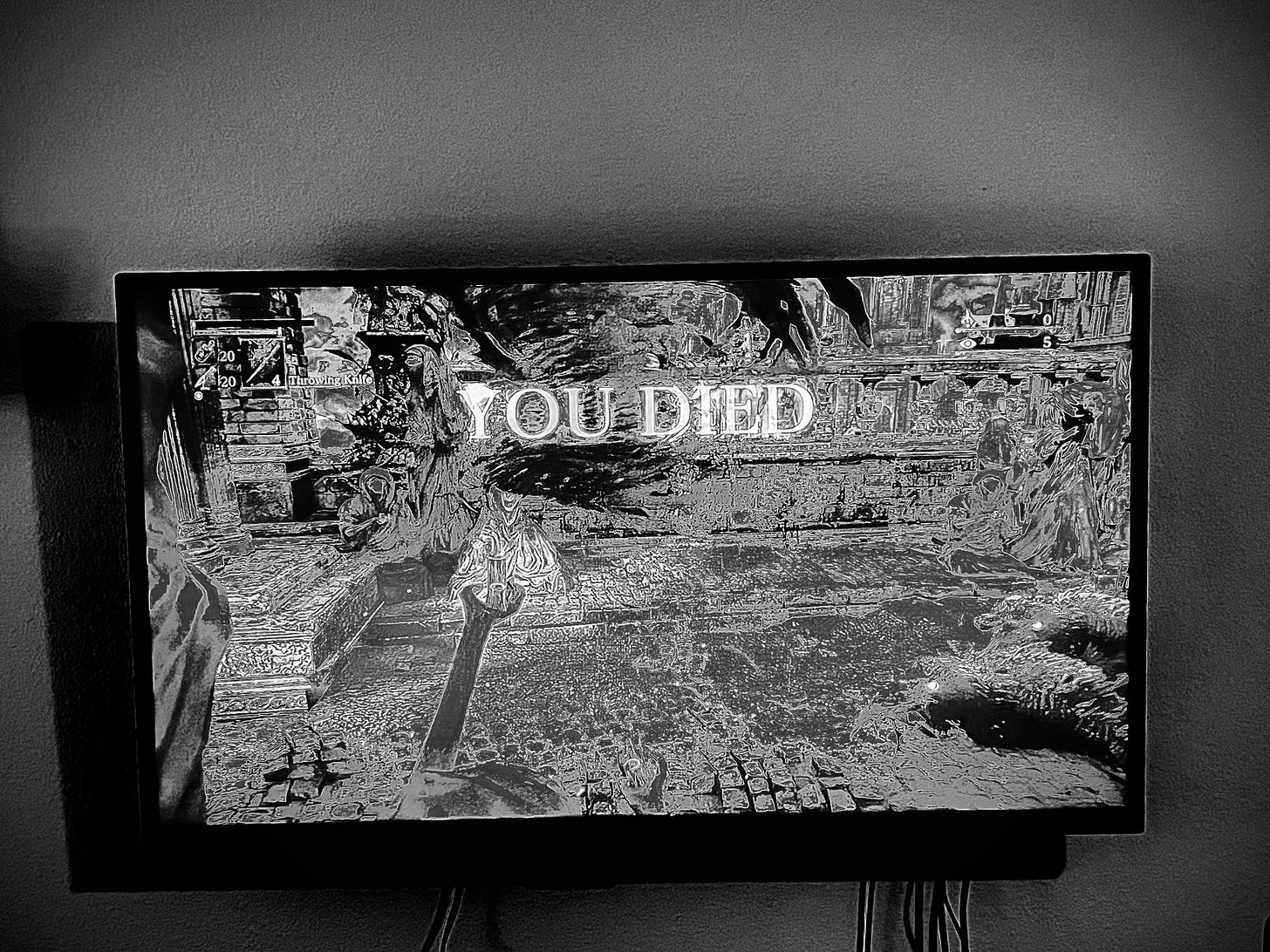 a black-and-white image of the Game Over message in 'Bloodborne'