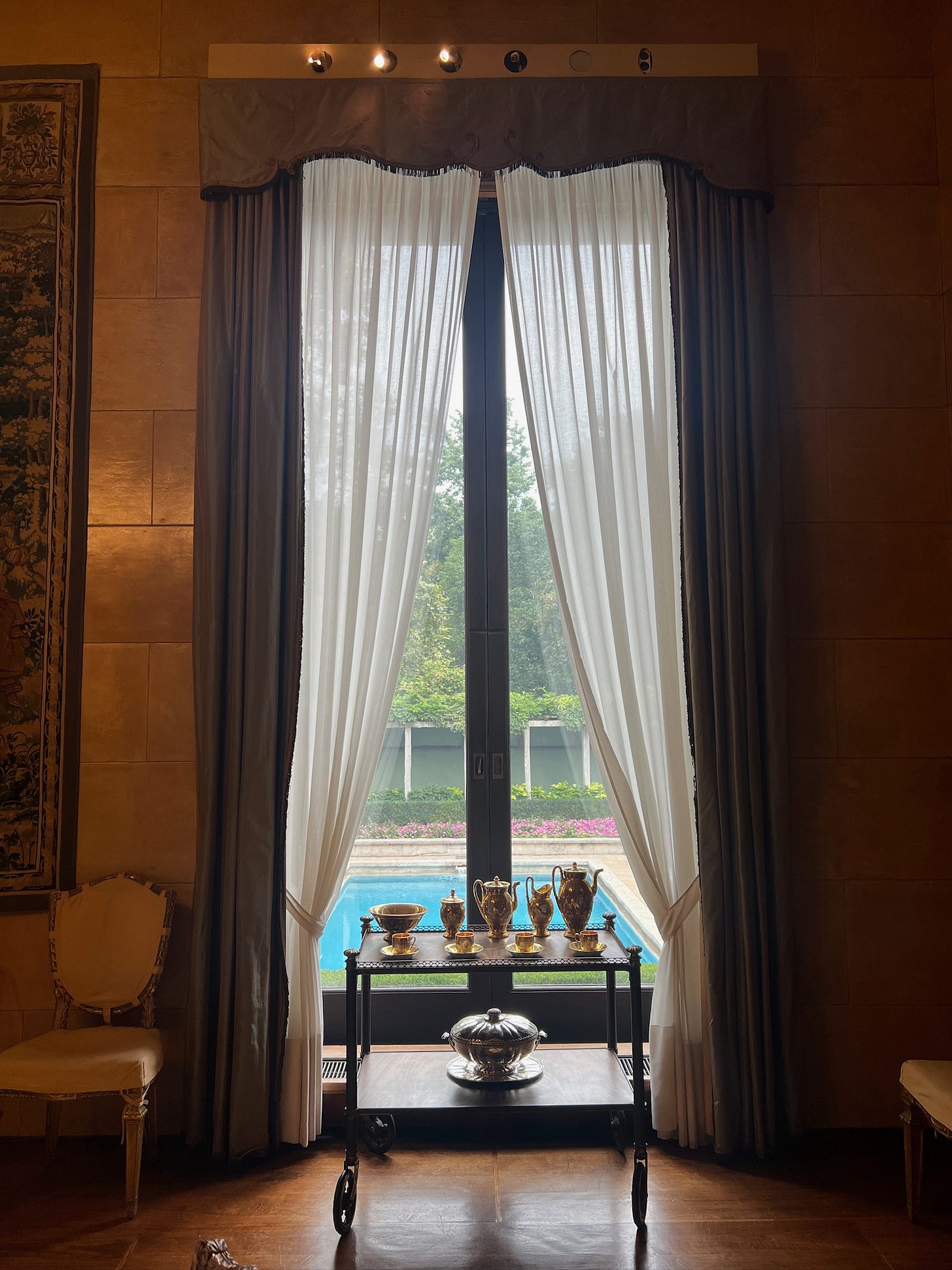 Inside  Villa Necchi in Italy, looking out to the pool.