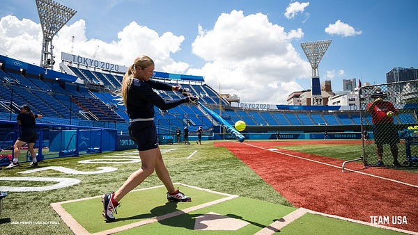 Ally Carda hits a ball during batting practice