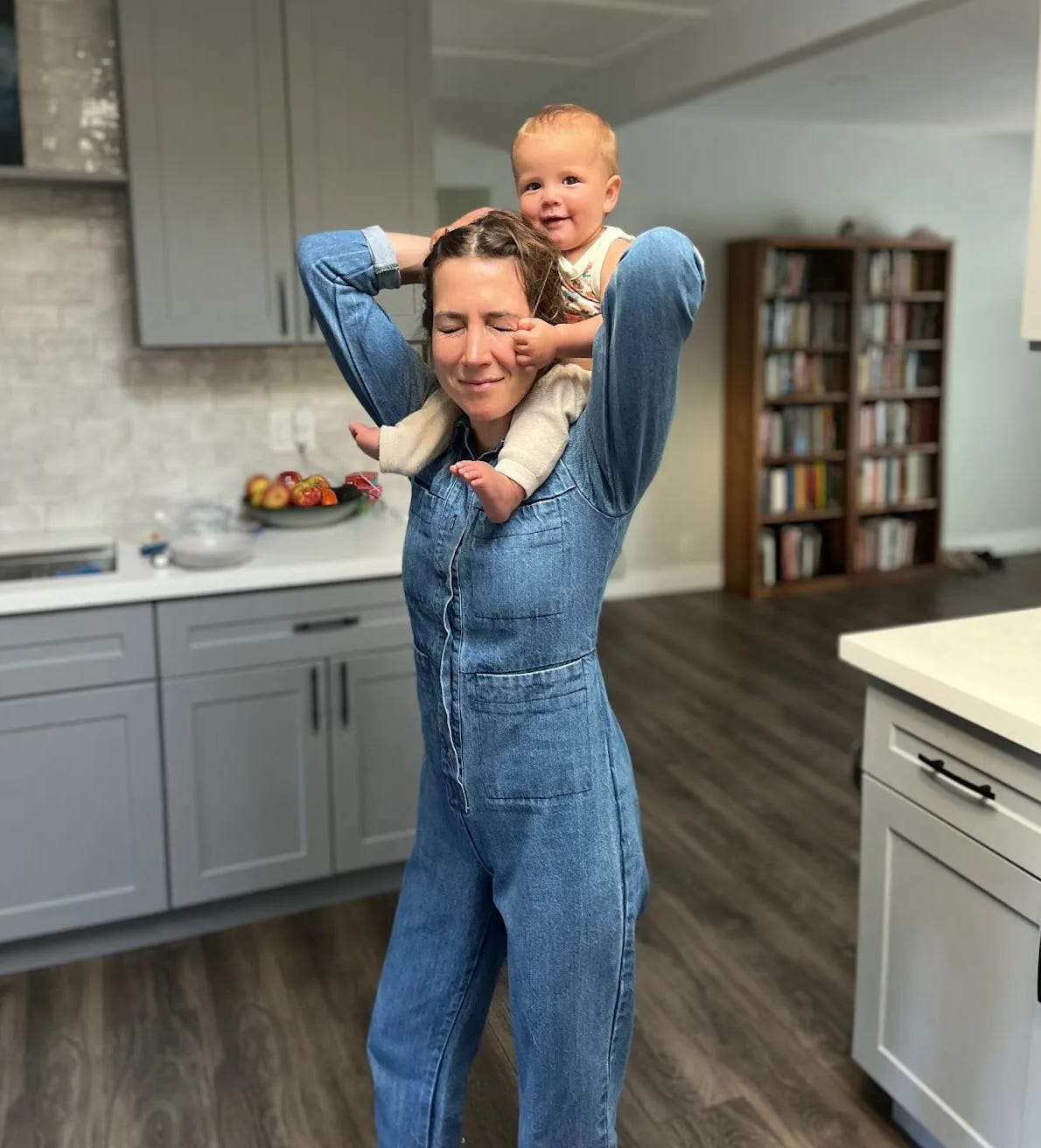 Zoë Schiffer carrying toddler