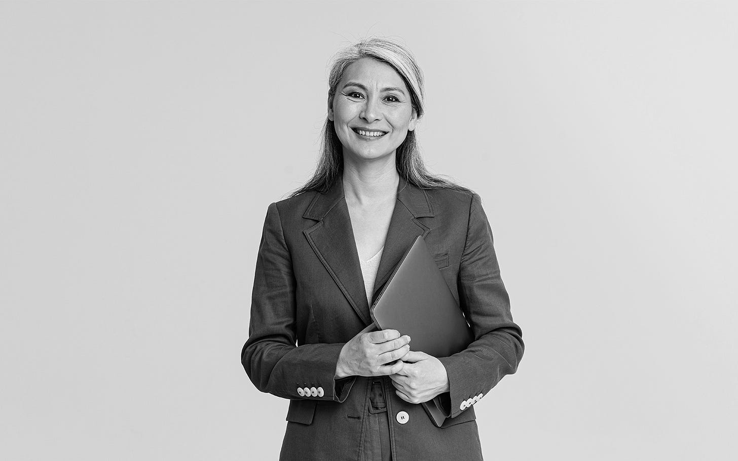 Smiling stock model on a gray background