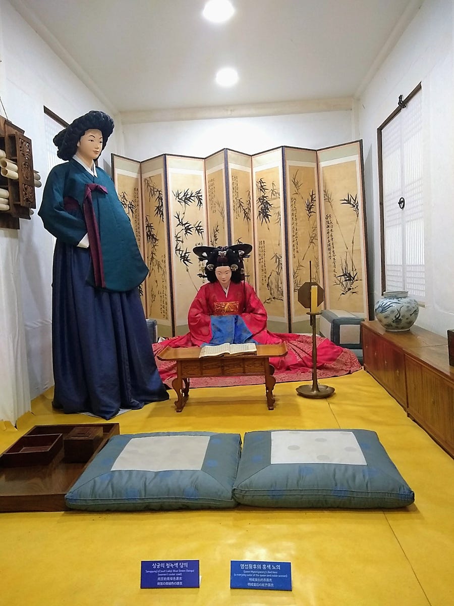 A room with a couple of mannequins in traditional clothing
AI-generated content may be incorrect. A room with a couple of mannequins in traditional clothing
AI-generated content may be incorrect.