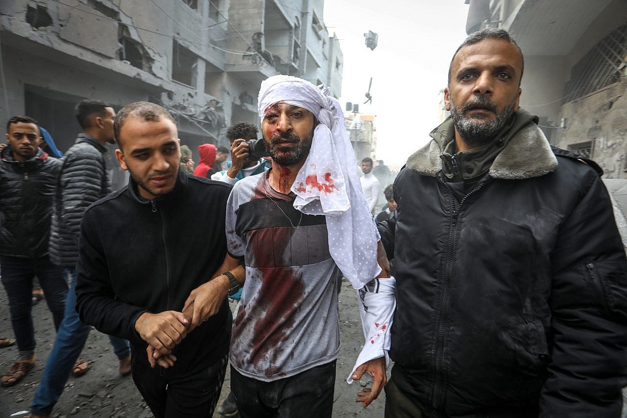 Palestinians survivors are brought out of the rubble of houses destroyed in an Israeli airstrike in the city of Rafah, southern Gaza Strip, November 20, 2023. (Abed Rahim Khatib/Flash90)