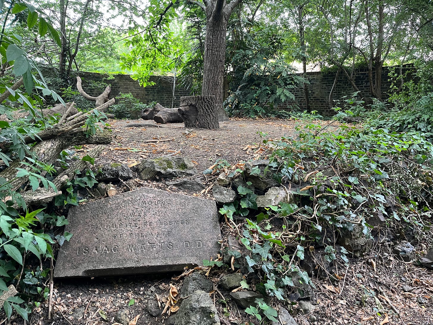Isaac Watts' Mound, an elevated platform in a forested setting with a stone label Isaac Watts' Mound, an elevated platform in a forested setting with a stone label