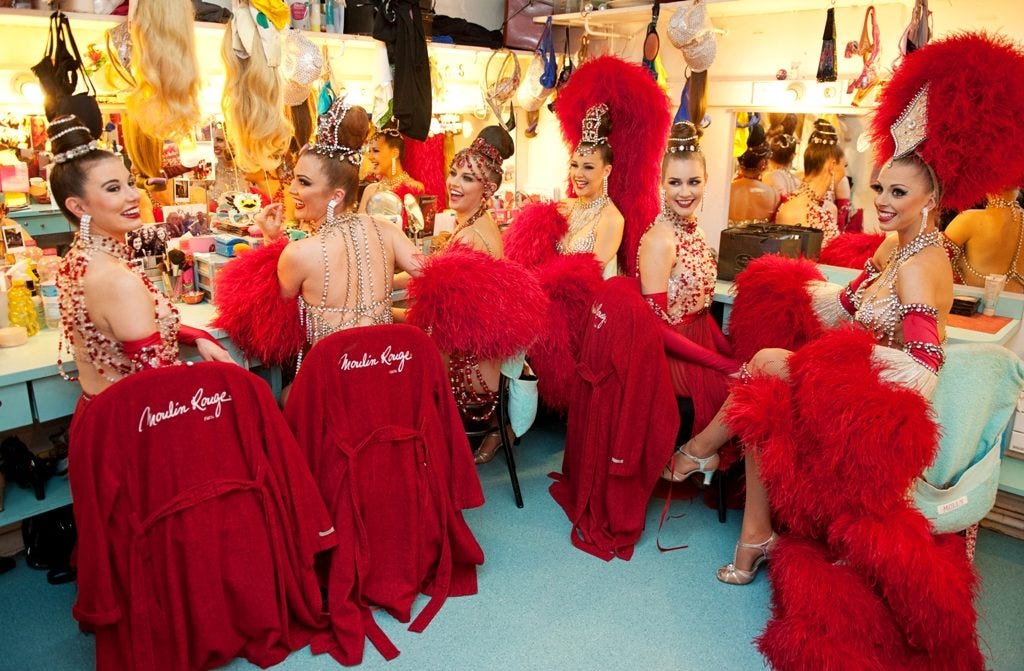 Claudine, sister Isabelle and fellow Moulin Rouge dancers in their dressing room. (Photo : Sandie Bertrand, Moulin Rouge)