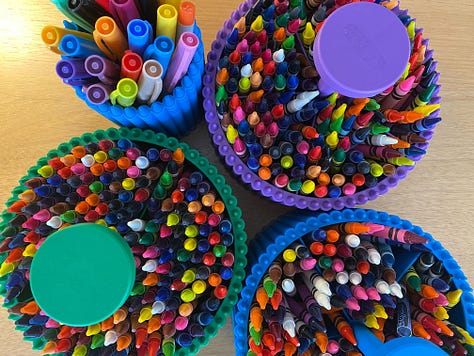 A Makerspace with creative tools like makers, paint, and crayons