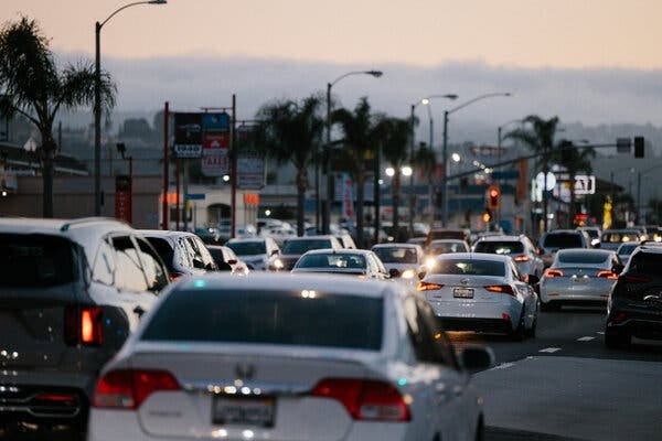 Bumper to bumper traffic on a highway in Los Angeles at dusk. 