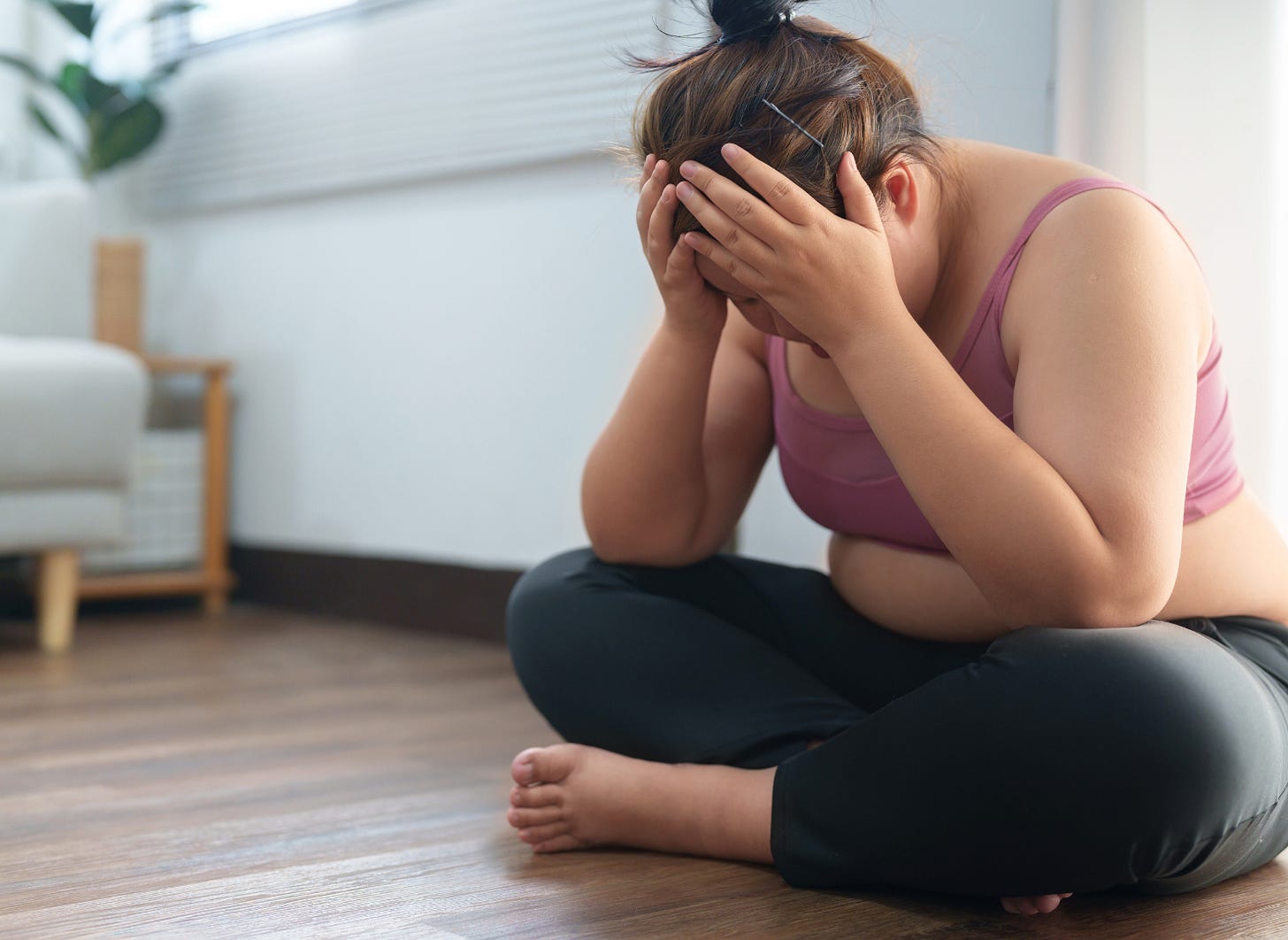 woman feeling overwhelmed and frustrated about her weight loss journey