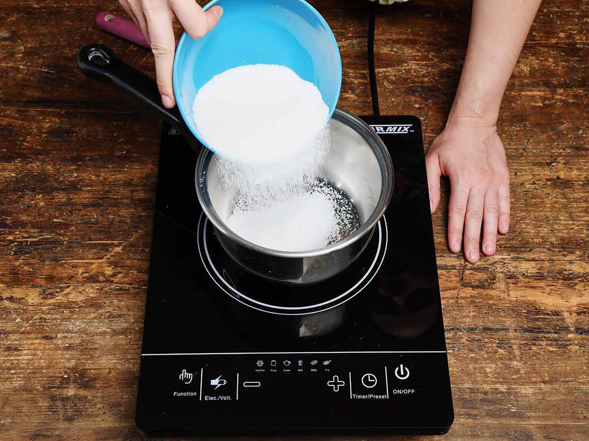 measuring sugar into pan measuring sugar into pan