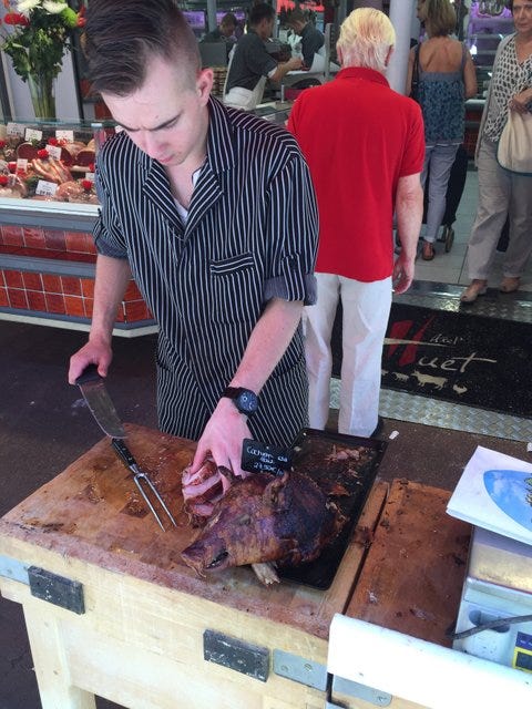 Butcher wrapping our veal. No one had taken the pig's head Butcher wrapping our veal. No one had taken the pig's head