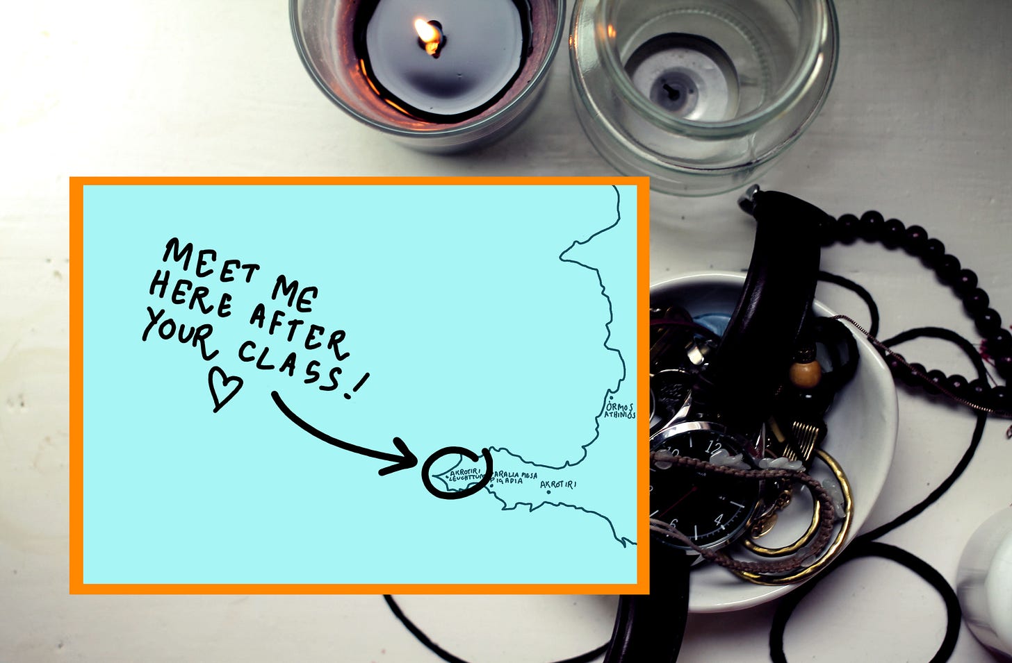 a photograph of a table with a candle and a note with a circle on a map of santorini and text saying "meet me here after your yoga class"