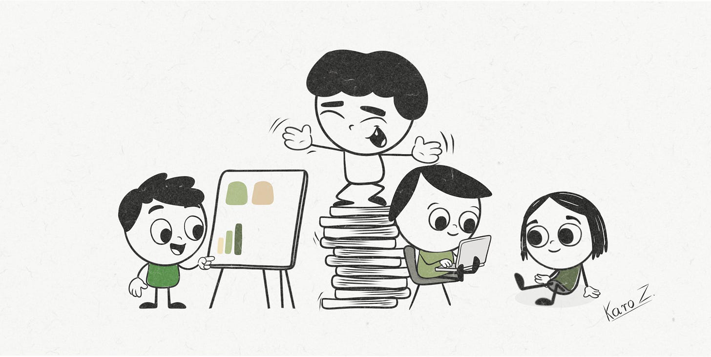 A joyful stickman cartoon by Karo Z from Product With Attitude shows a team of four characters collaborating—one pointing to a chart, one working on a laptop, one sitting calmly, and one dramatically standing on a wobbling stack of books as if giving a TED Talk.
