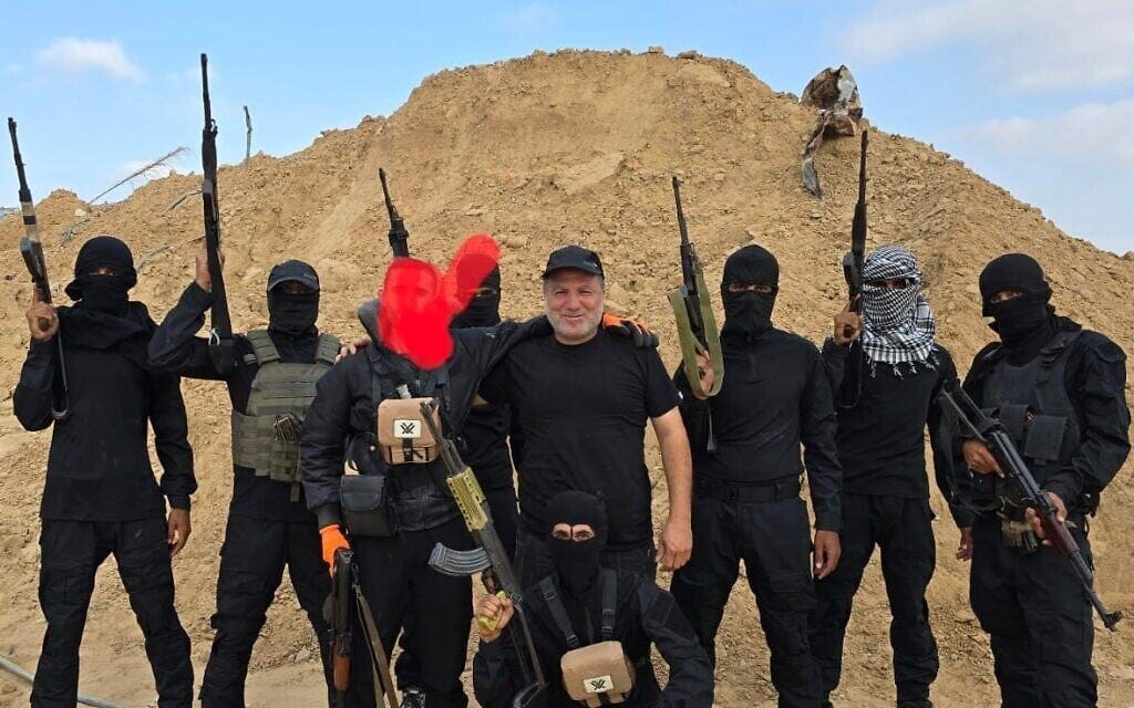 Hossam al-Astal (center) is seen surrounded by armed members of his group, 'Strike Force Against Terror,' in an undated picture from the Gaza Strip posted on Facebook. (Courtesy: Hossam al-Astal via Facebook)