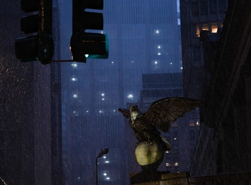 a statue of an eagle on top of a building