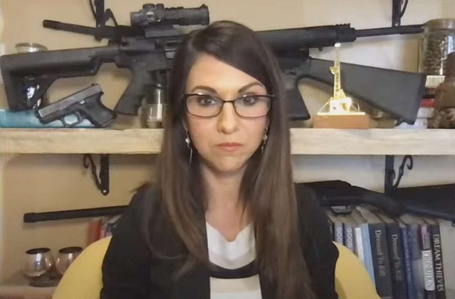 a woman wearing glasses and smiling at the camera: Rep. Lauren Boebert of Colorado Screenshot via House Committee on Natural Resources