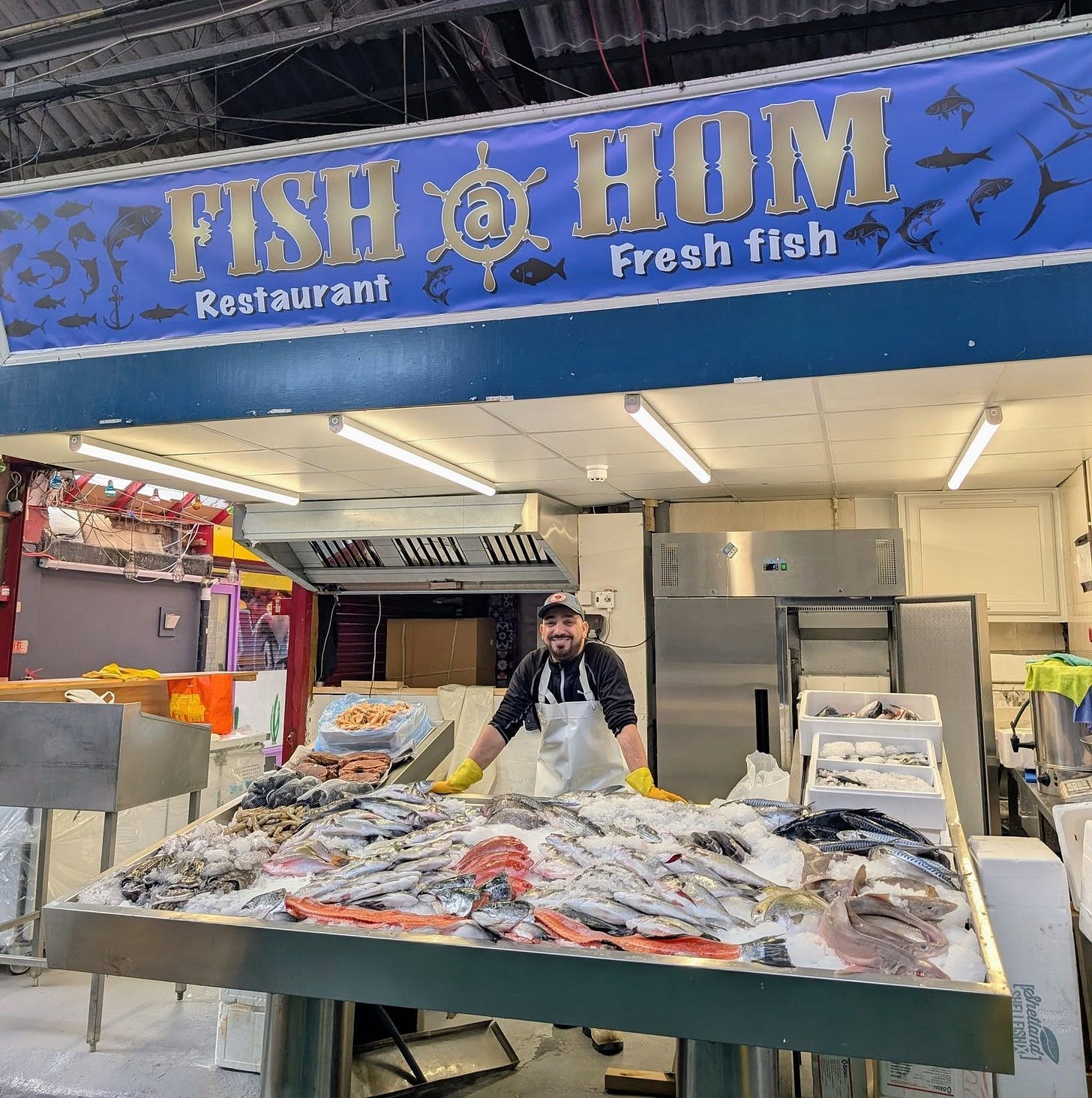 May be an image of 1 person and text that says "FISH FISH ර HΘM Fresh fish Freshfish fish አረ Restaurant WIIH UIIIE" May be an image of 1 person and text that says "FISH FISH ර HΘM Fresh fish Freshfish fish አረ Restaurant WIIH UIIIE"