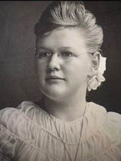 A person with a flower in her hair

AI-generated content may be incorrect.