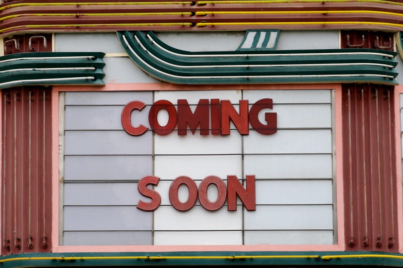 close-up of a vintage theater marquee with the words COMING SOON close-up of a vintage theater marquee with the words COMING SOON
