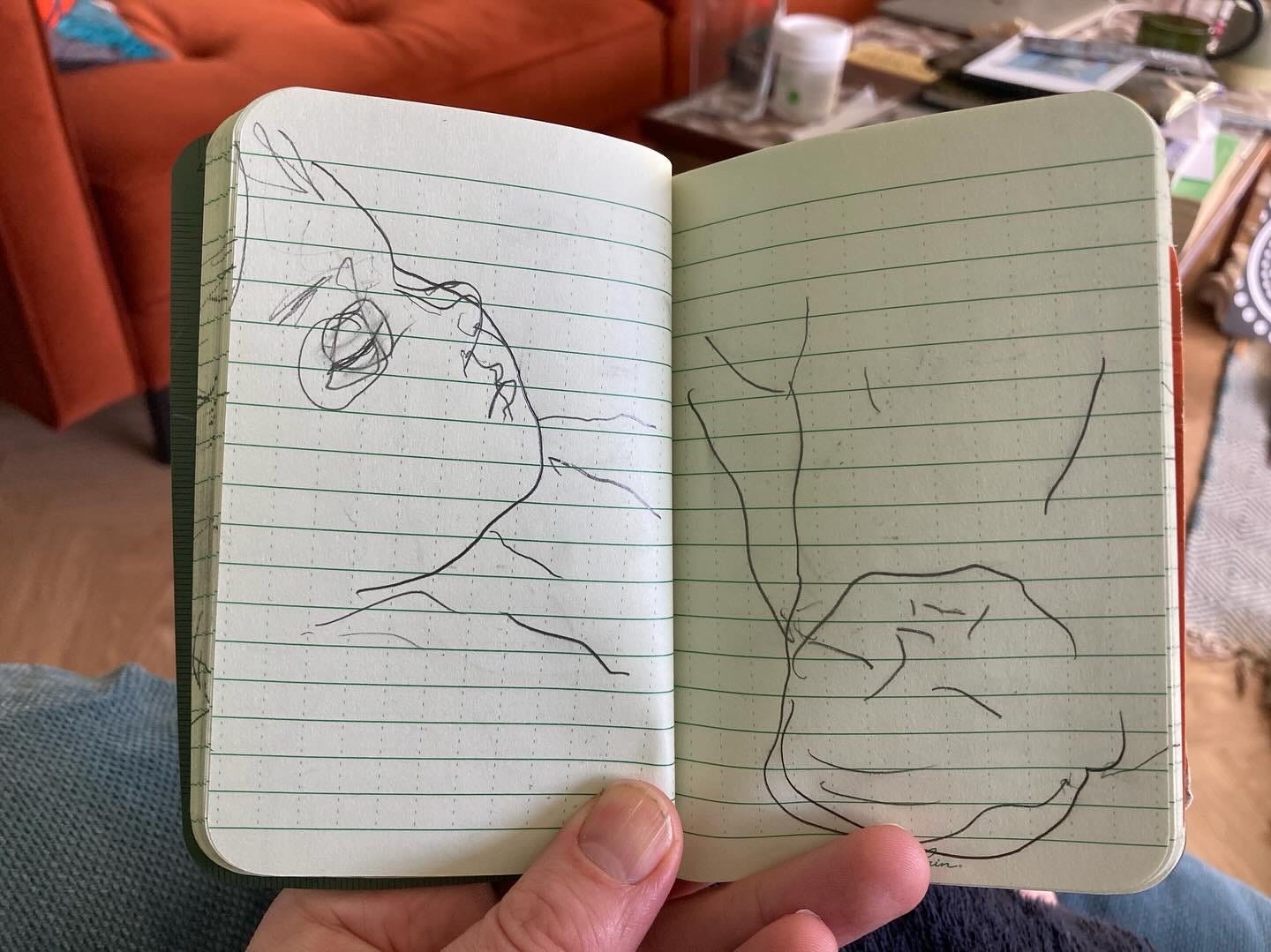Two pencil drawings of a baby in a lined notebook