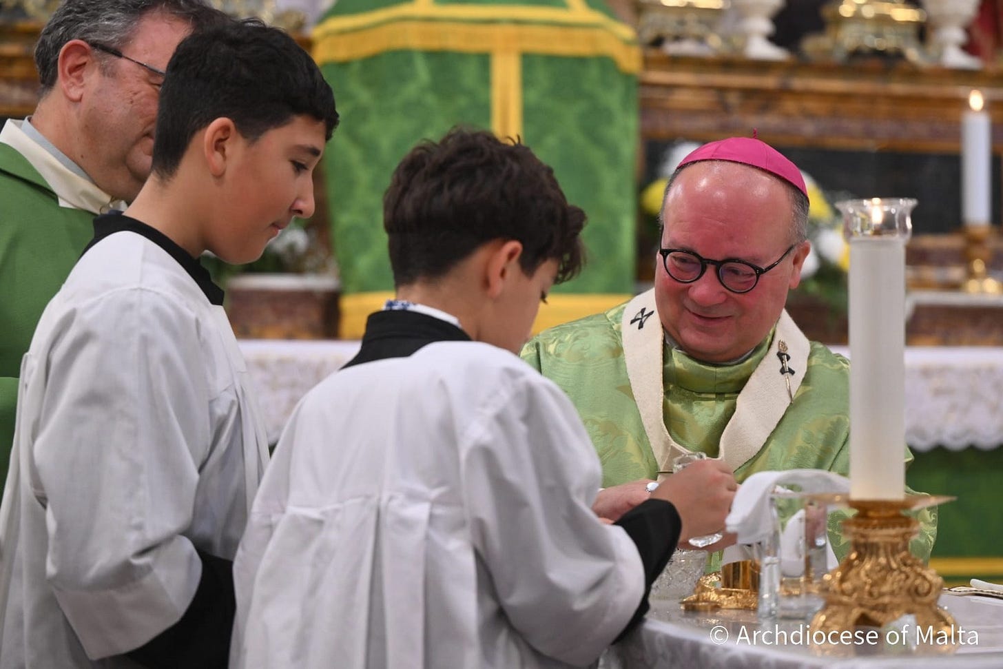 May be an image of text that says "4 Archdiocese ArchdioceseofMalta of Malta"