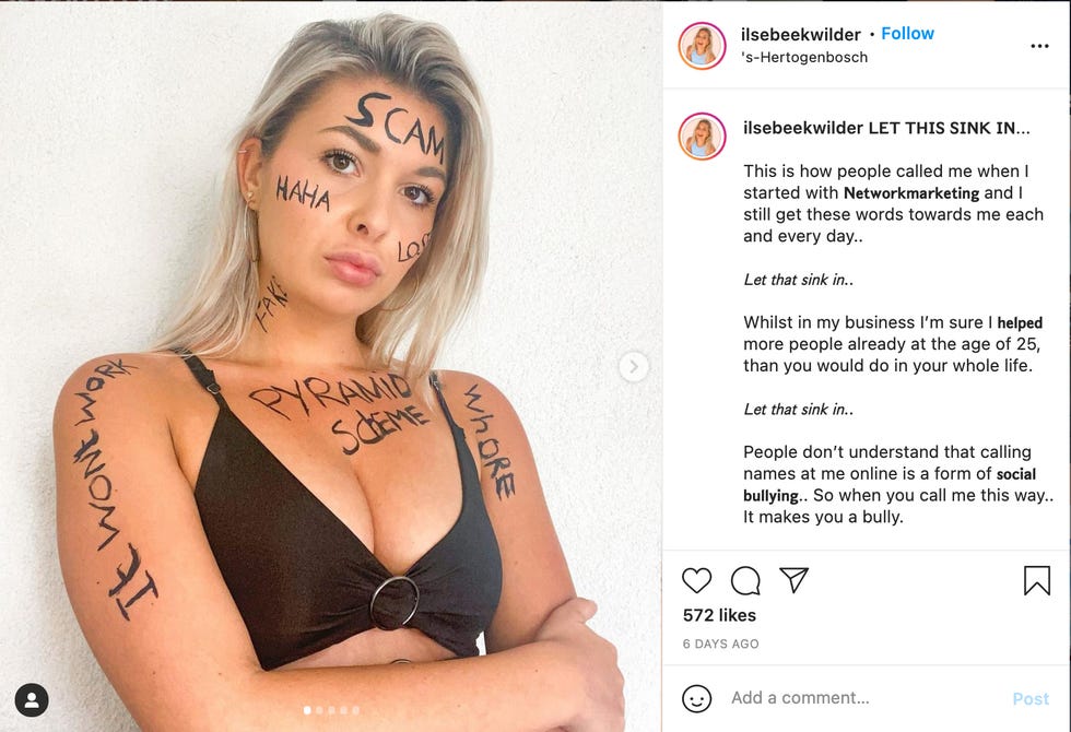 A boss babe who wrote "scam" and "pyramid scheme" on her body to protest the bullying of boss babes online. A boss babe who wrote "scam" and "pyramid scheme" on her body to protest the bullying of boss babes online.