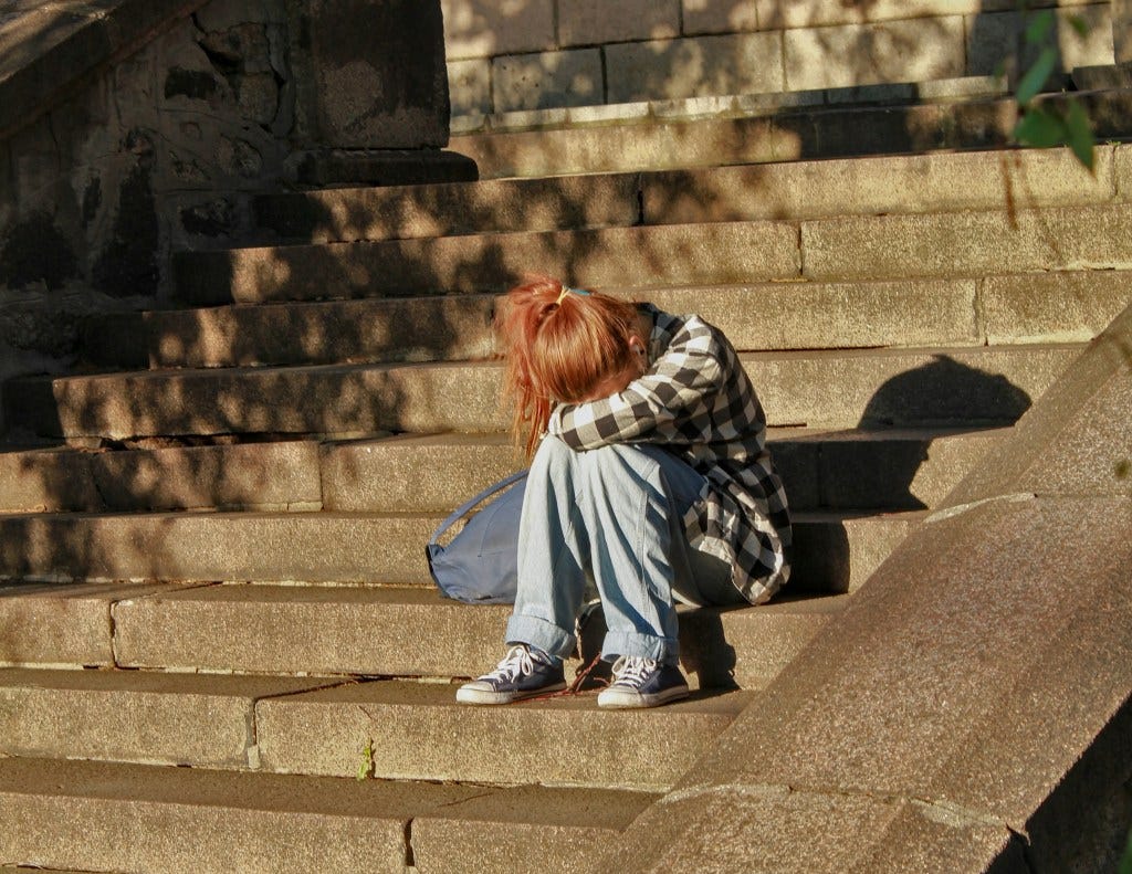 Sad girl on steps