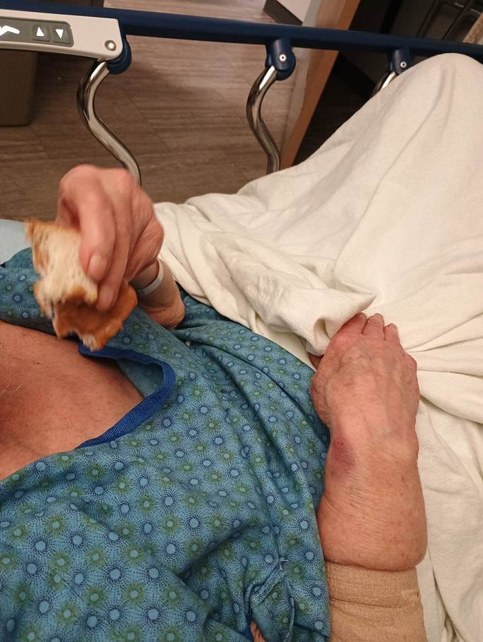 A person lying in a hospital bed

AI-generated content may be incorrect.
