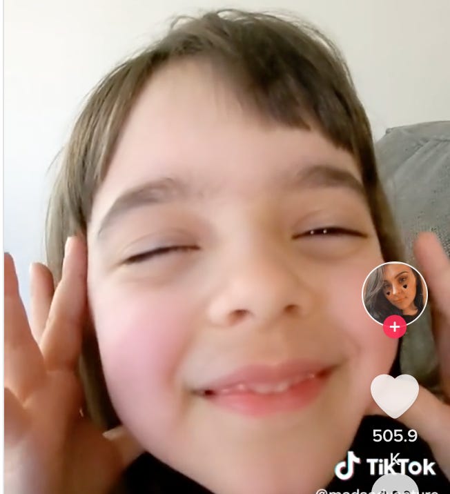 still image from embedded TikTok of a little girl opening her eyes after surgery recovery