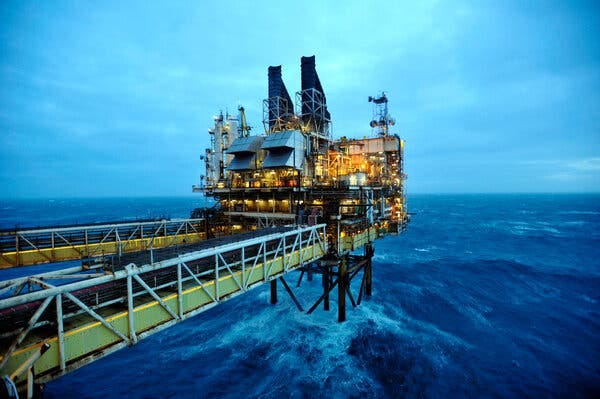 An oil platform in choppy water.
