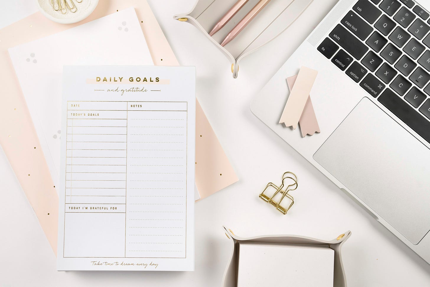 light elegant desktop with laptop and notepads