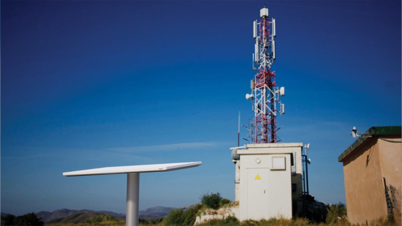 An image of Project Kuiper’s enterprise-grade customer terminal antennas next to an antenna. An image of Project Kuiper’s enterprise-grade customer terminal antennas next to an antenna.