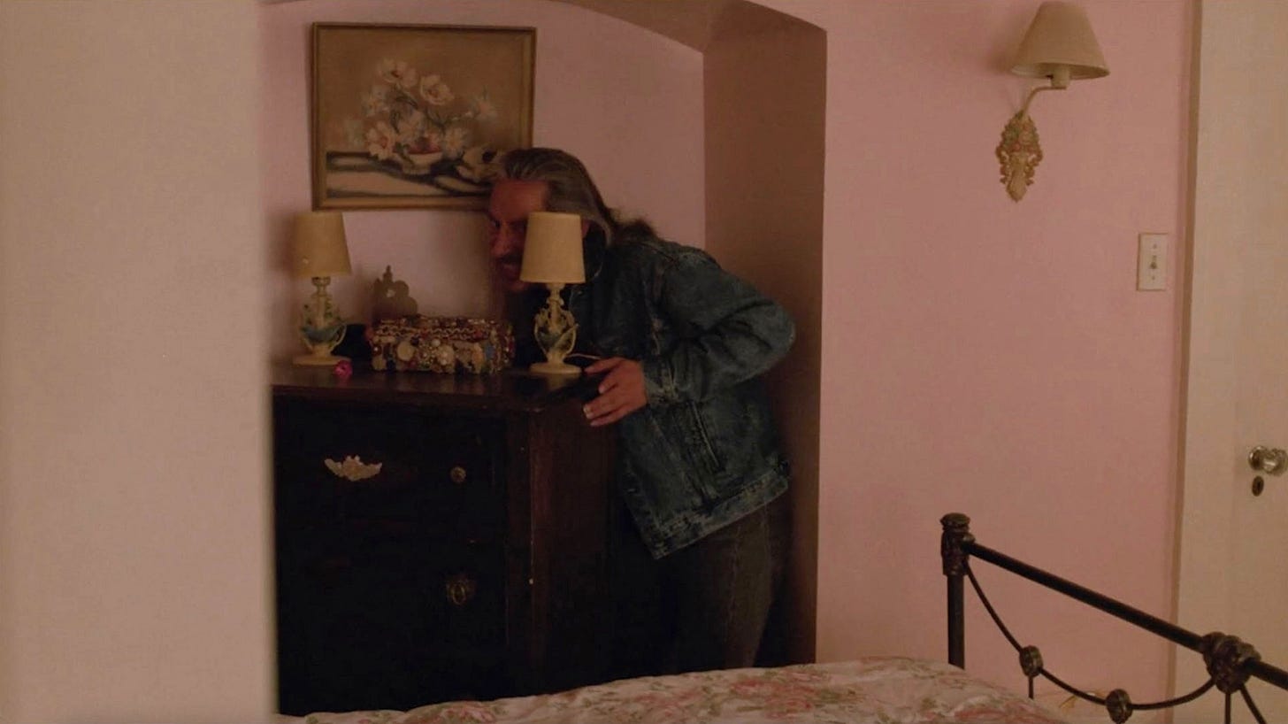 still shot from "Twin Peaks" tv show with Killer BOB behind dresser in pink room